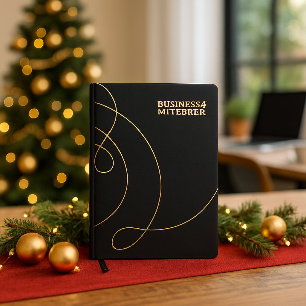 Premium A5 business notebook with golden cursive design on a wooden desk