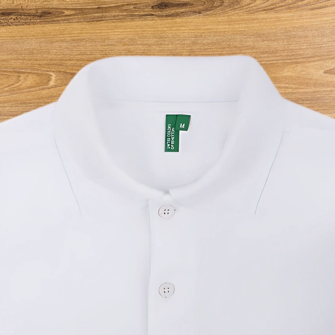 “Close-up of Benetton white polo t-shirt collar and buttons”