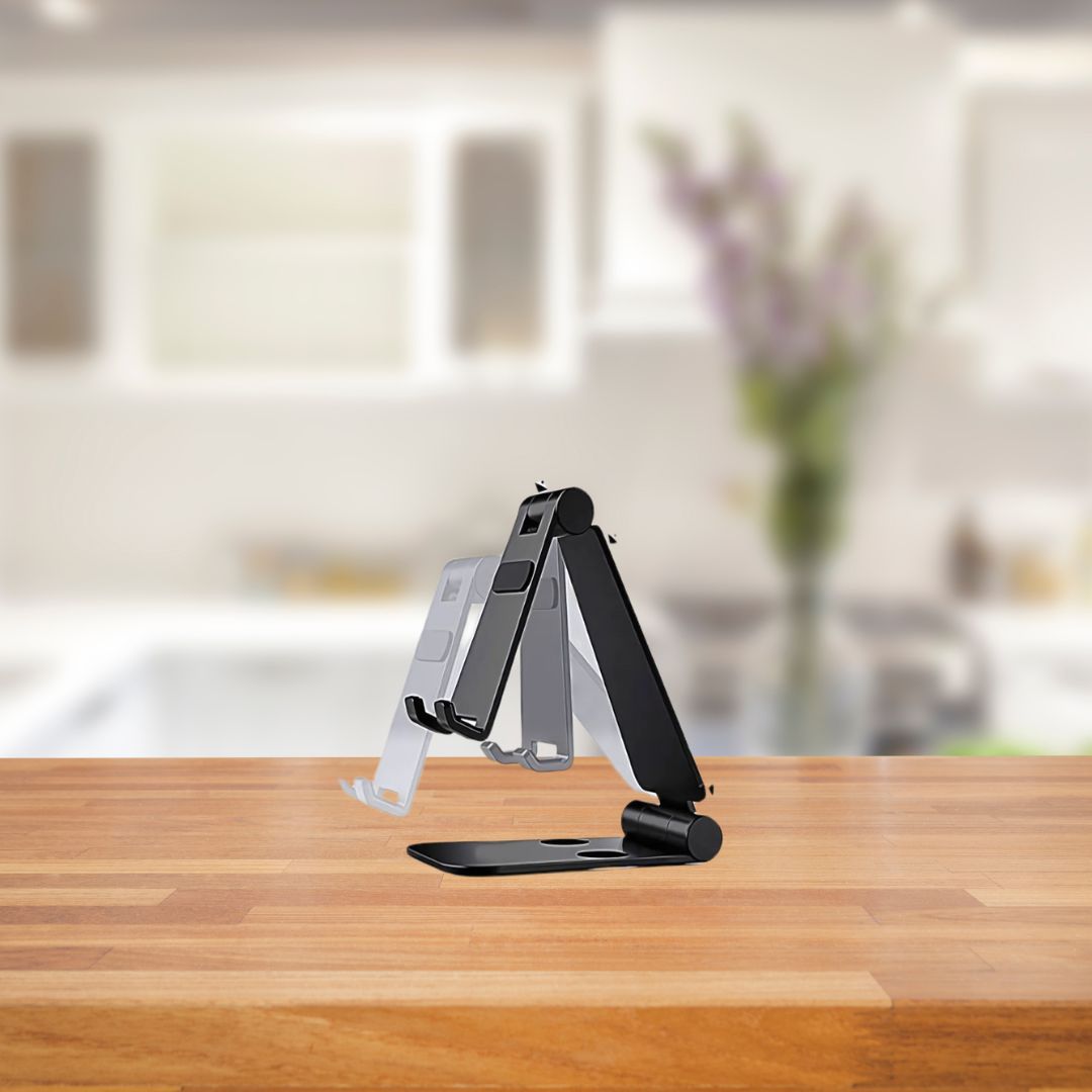 Smartphone on folding metal stand placed on desk