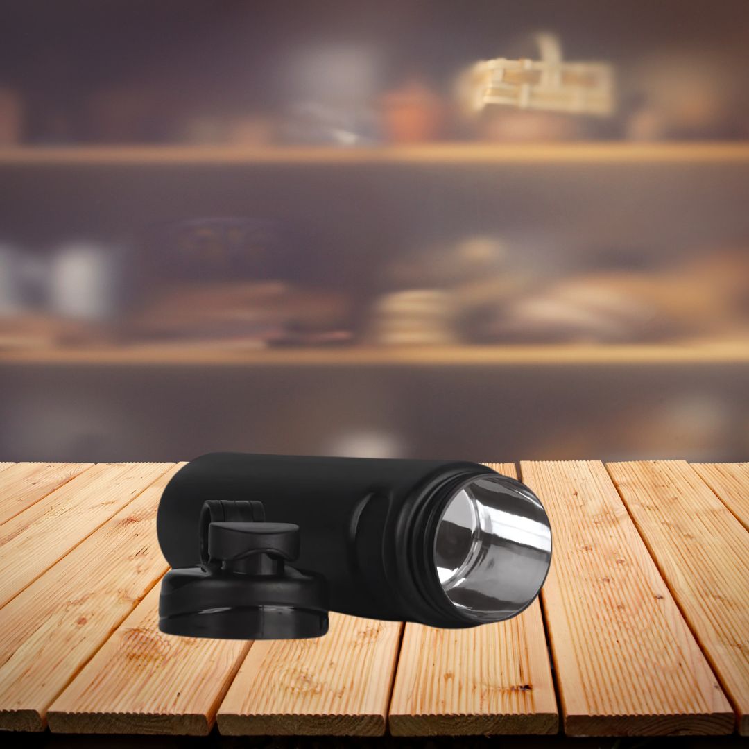Leak-proof insulated steel flask bottle on wooden tabletop
