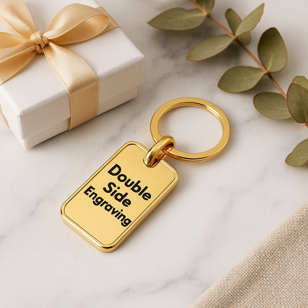 Back view of rectangle metal keychain in shiny gold finish