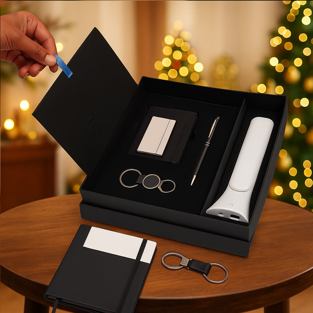 Q152 multipurpose gift set open box view with pen, keychain, card holder, notebook, and lamp