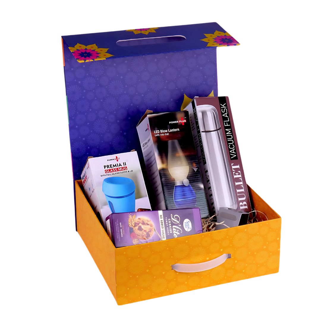 Open magnetic gift box showing flask, mug, LED lamp, cookies, and stand