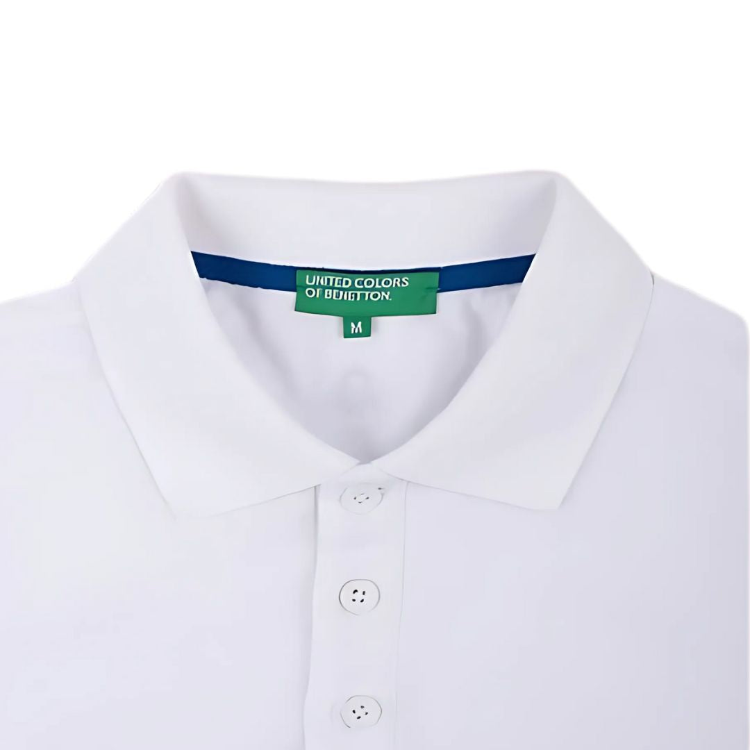 Model wearing white UCB polo T-shirt for men – breathable cotton polyester fabric