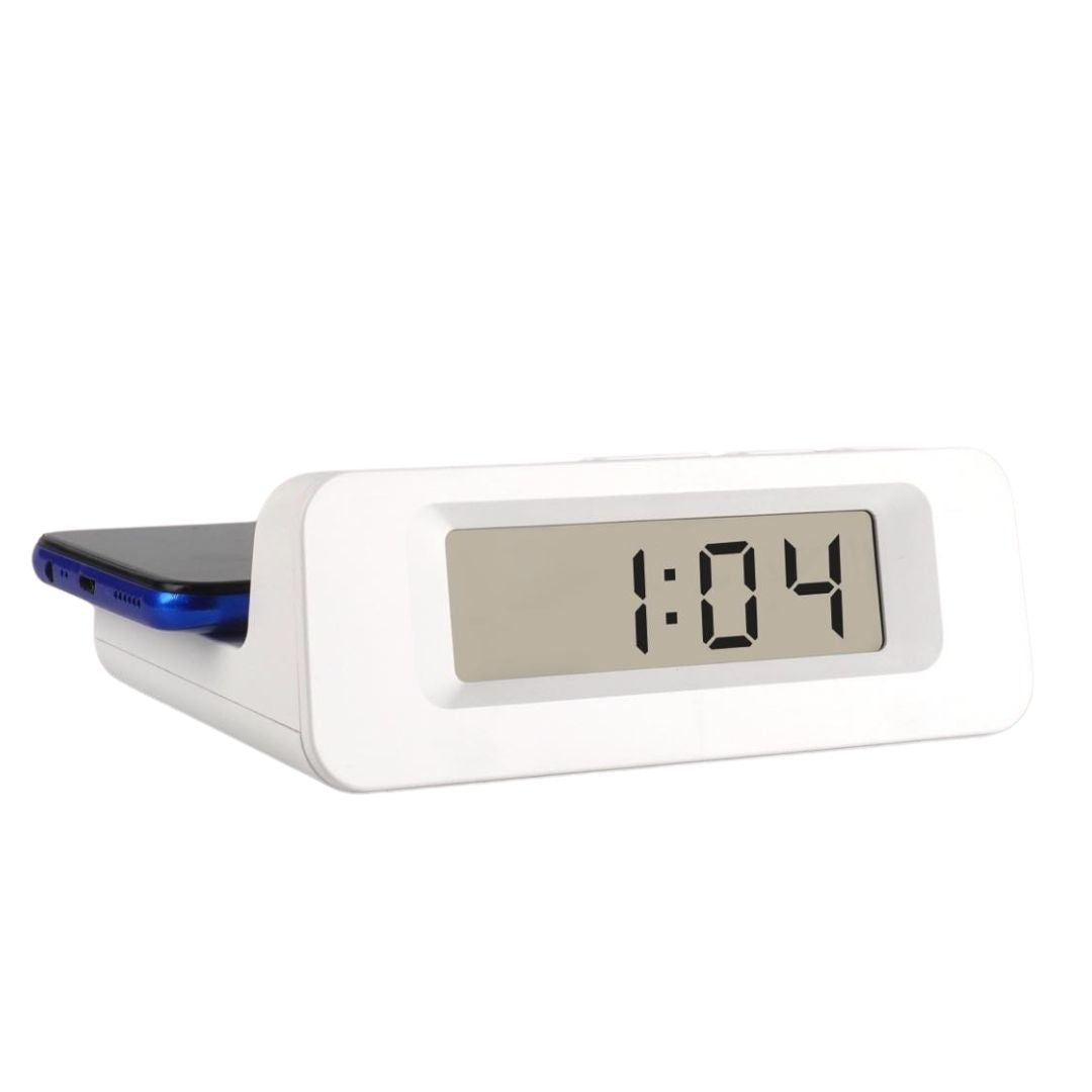 Digital clock with 10W wireless charger showing phone charging on top