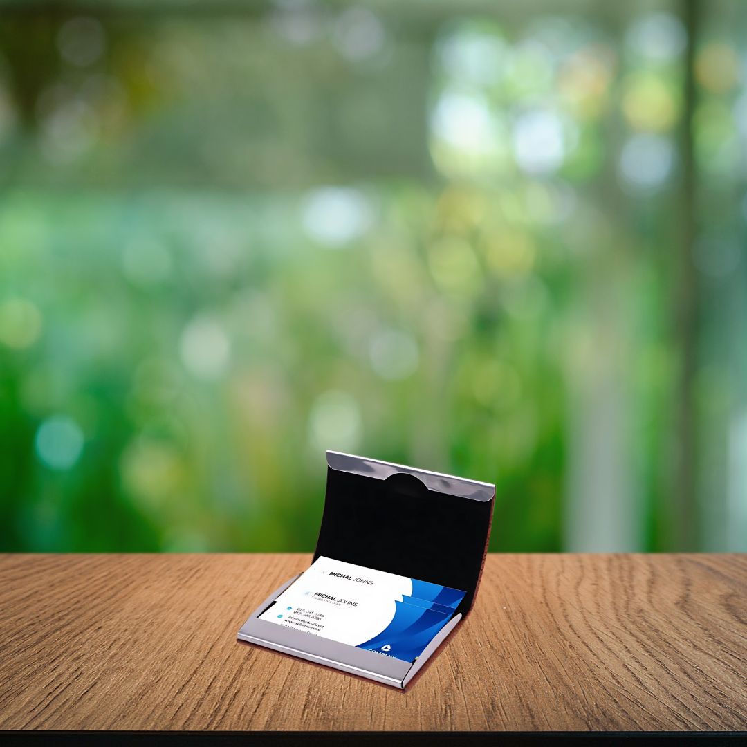 Stainless steel magnetic visiting card holders in black, brown, and blue with branding plates