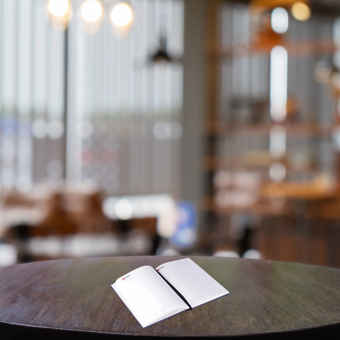 Open view of Castillo Milano keyboard design notebook with premium pages
