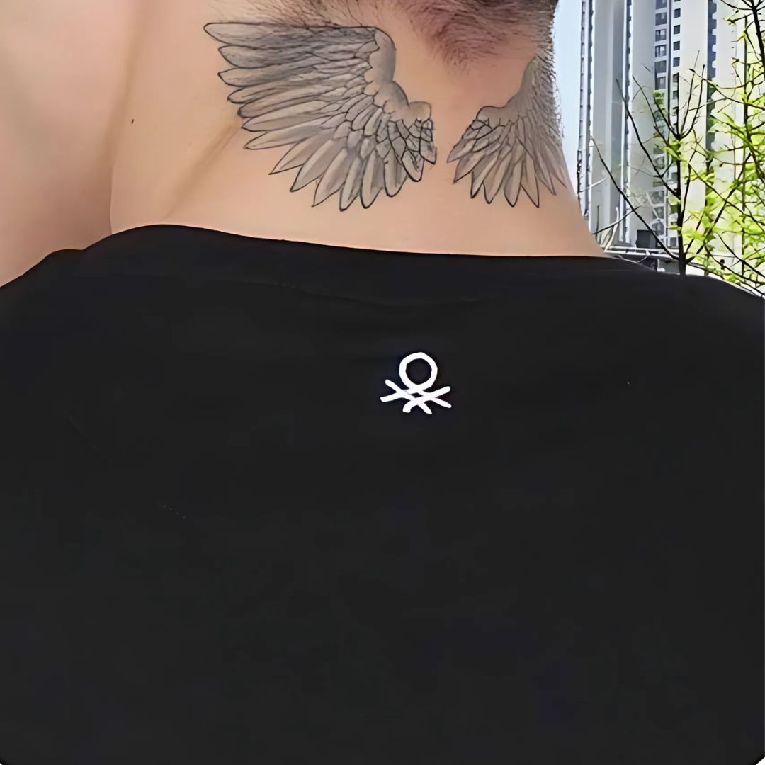 Back view of Benetton black t-shirt with white stitched logo
