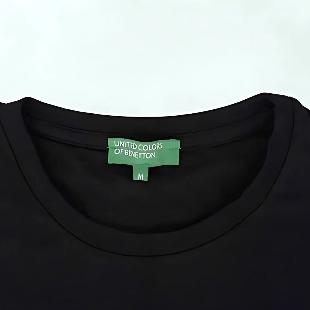 Collar view showing Benetton green neck label on black t-shirt
