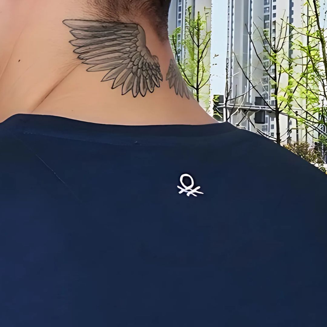 "Benetton round neck t-shirt close-up of collar and brand label"