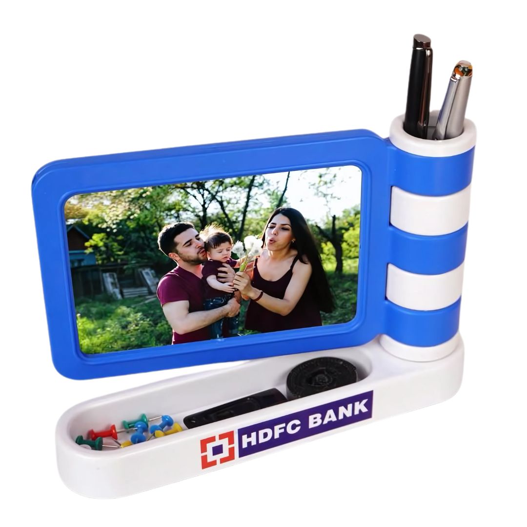 Flag style photo frame with pen stand and stationery holder placed on a desk