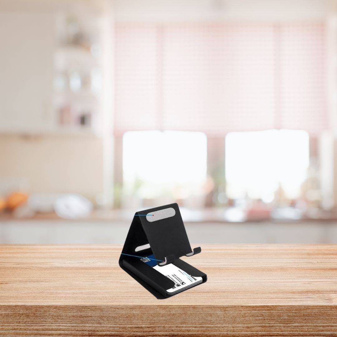Black metal mobile stand with visiting card holder on wooden desk, front view