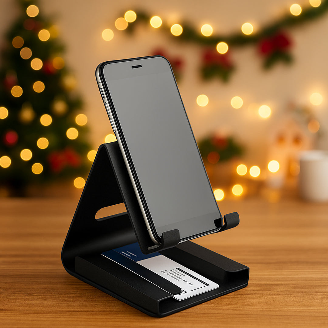 Black metal mobile stand with visiting card holder on wooden desk, front view