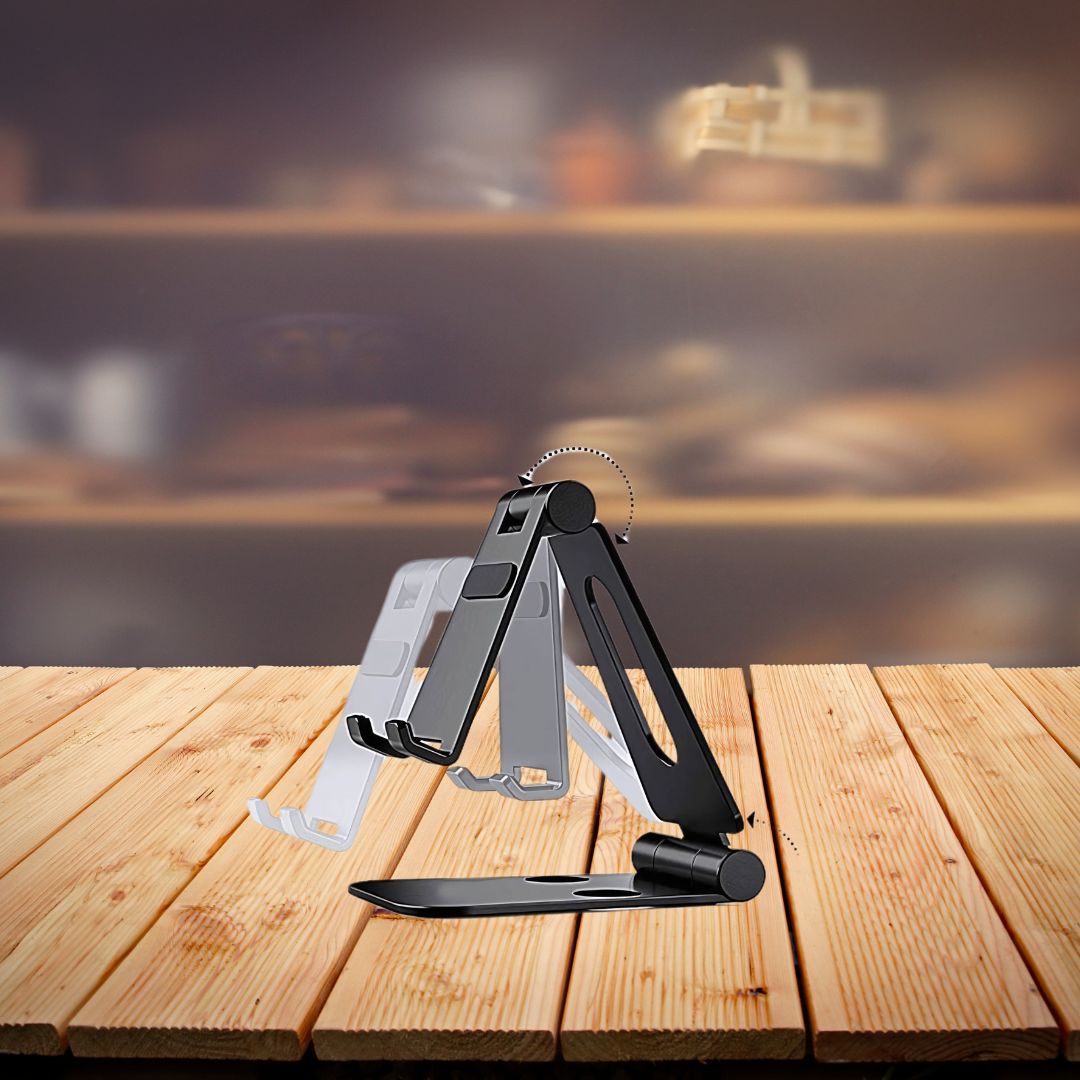 Folding metal mobile stand holding smartphone on desk