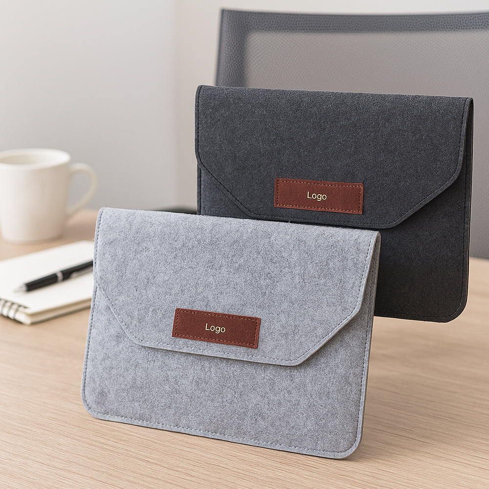 15.6-inch felt laptop sleeve in dark grey with leather accent, ideal for office and corporate gifting
