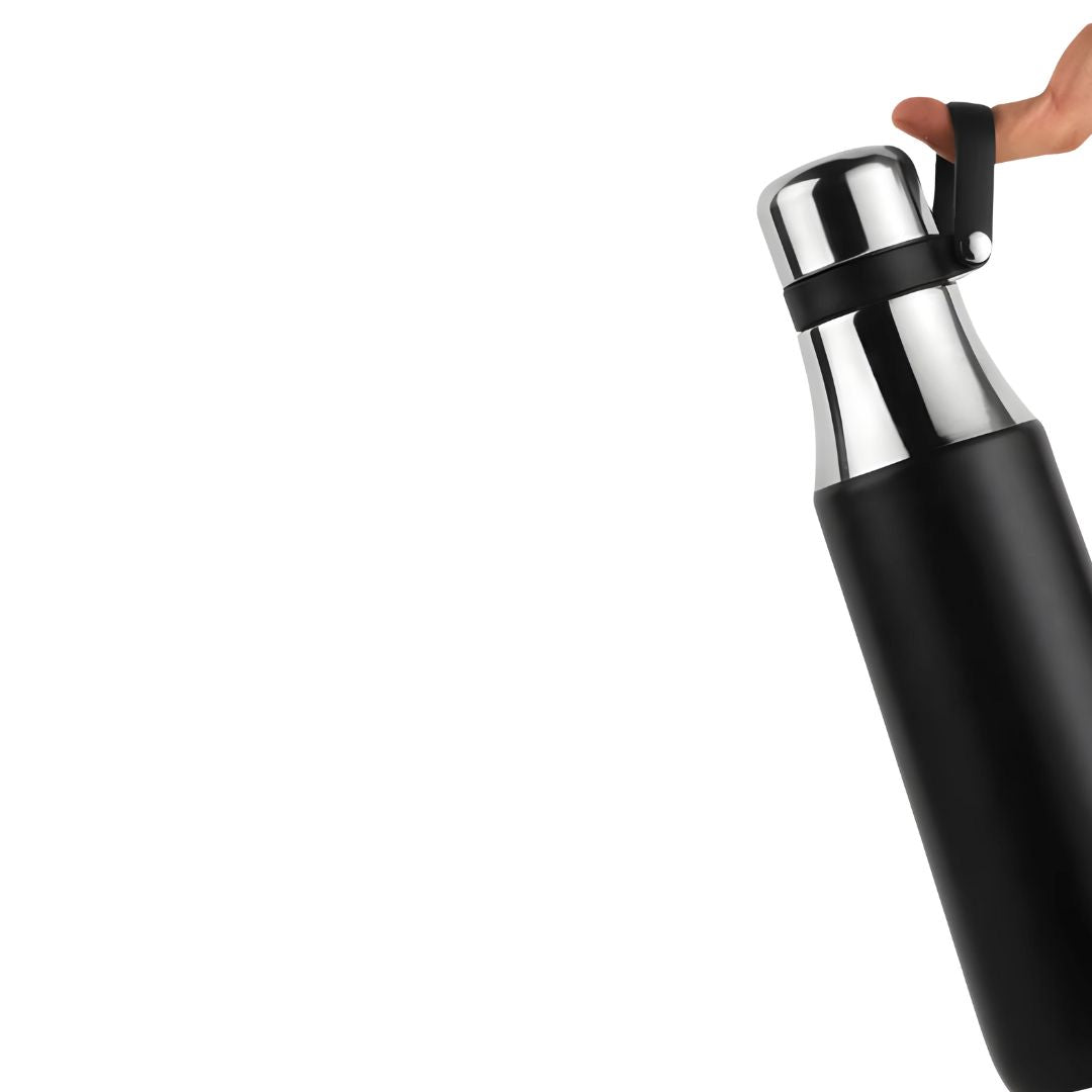 Stainless steel vacuum insulated flask with handle, shown handheld for easy carrying