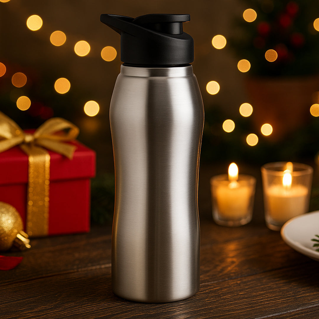 Curvy stainless steel water bottle 1L in natural silver with BPA-free cap, lifestyle setting