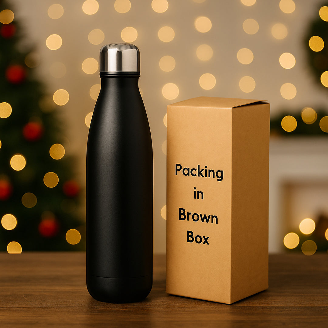Stylish black stainless steel cola bottle with gift box in kitchen background