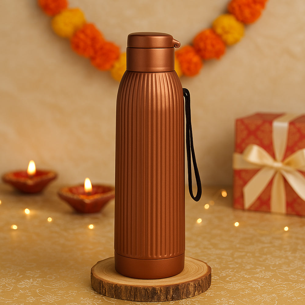 “Ribd Copper insulated copper bottle with flip-top lid – 750 ml, keeps drinks hot or cold for 4–6 hours”
