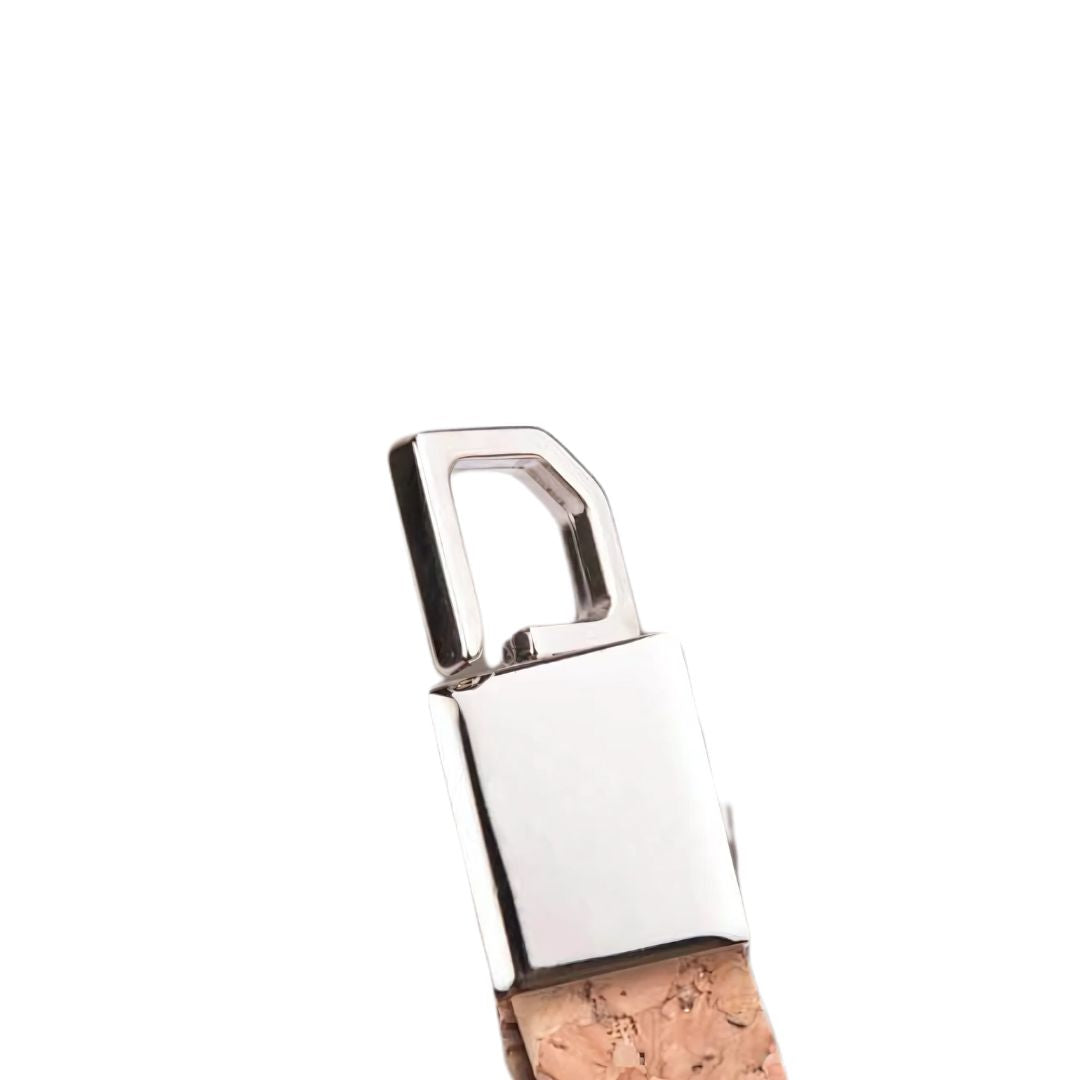 Close-up view of eco-friendly rectangle metal keychain with cork strap