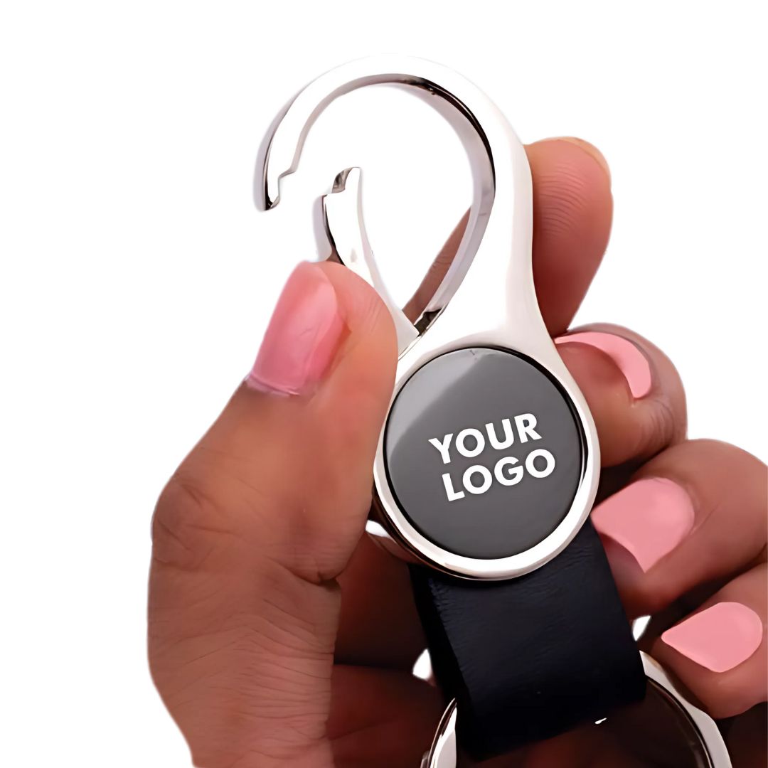 Round hanging metal keychain with PU strap, gunmetal finish, flat lay view