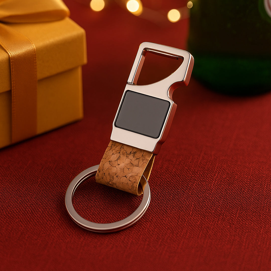 Rectangle hanging metal keychain with cork strap being used as a bottle opener