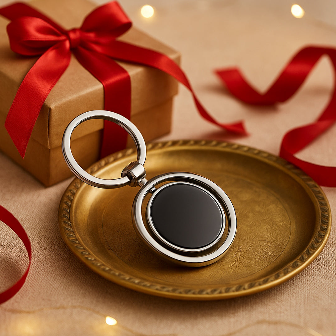 Round rotating keychain with silver finish and branding area – front view