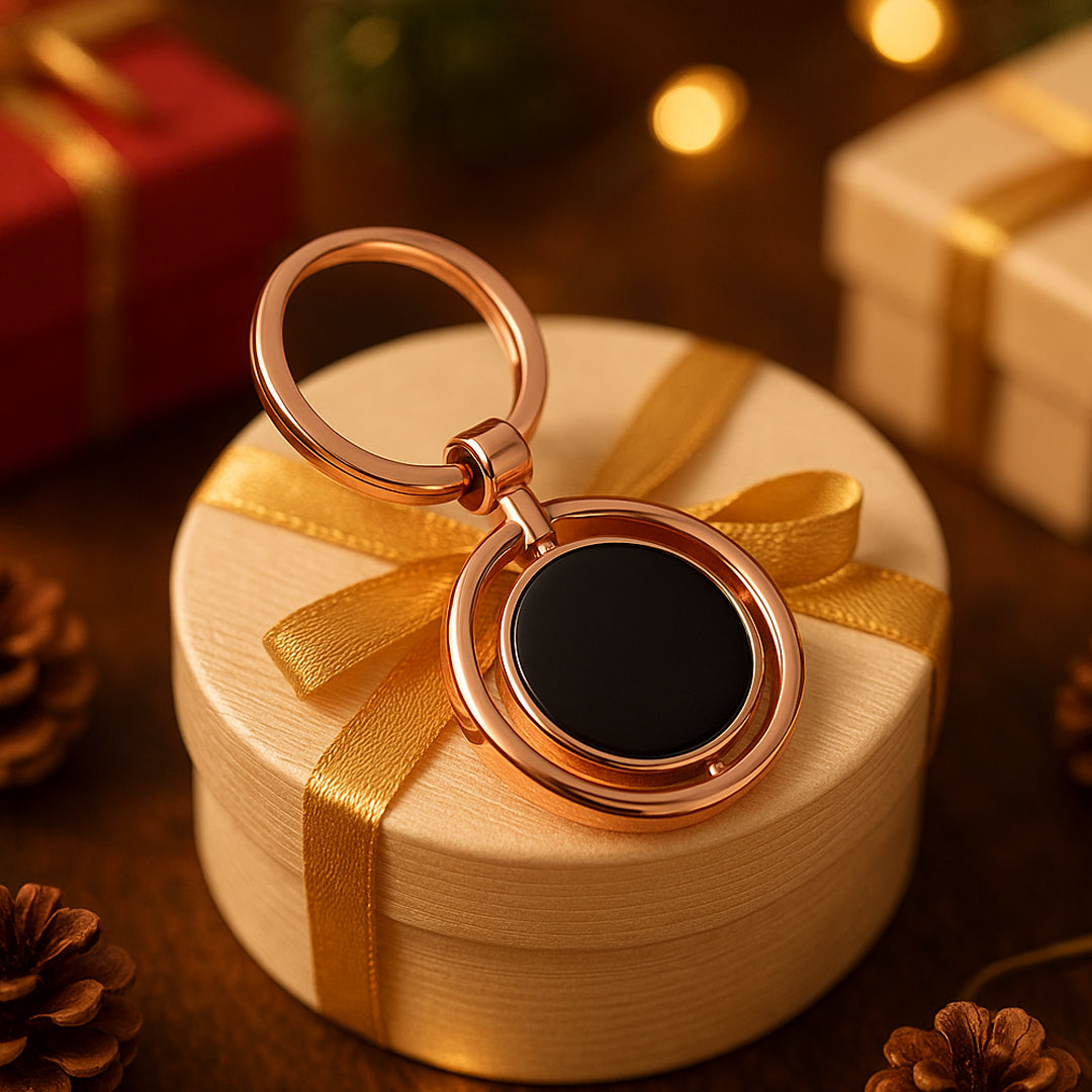 Round rotating keychain in rose gold finish with double side branding area – front view