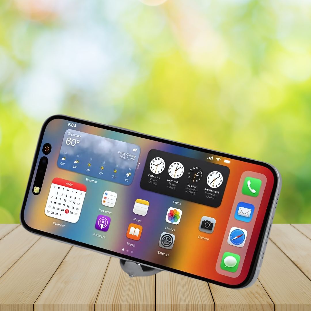 Keychain used as phone stand on wooden desk – lifestyle view