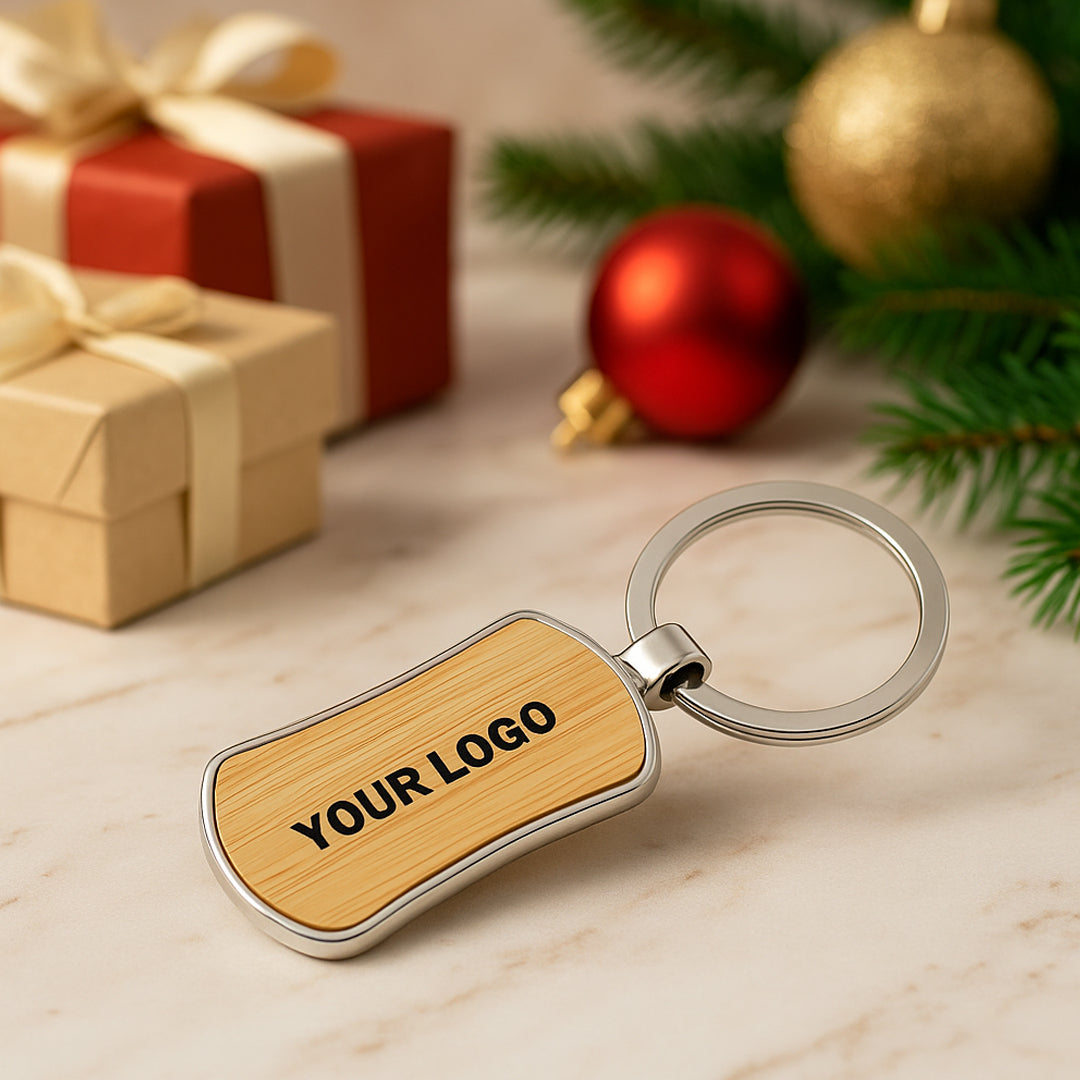 Eco-friendly bamboo and metal keychain on wooden table