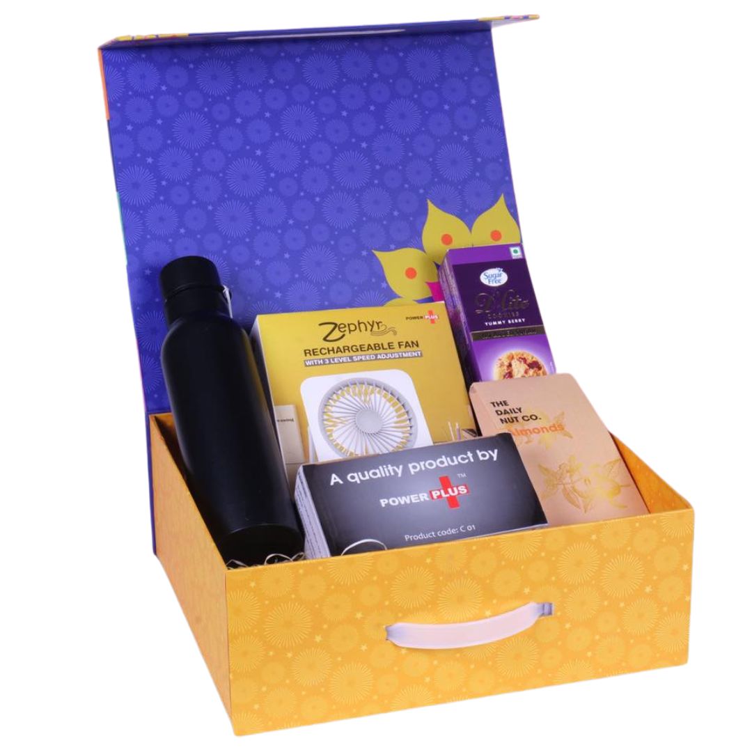 Full contents of premium celebration gift set including bottle, fan, cookies, almonds, and mini speakers