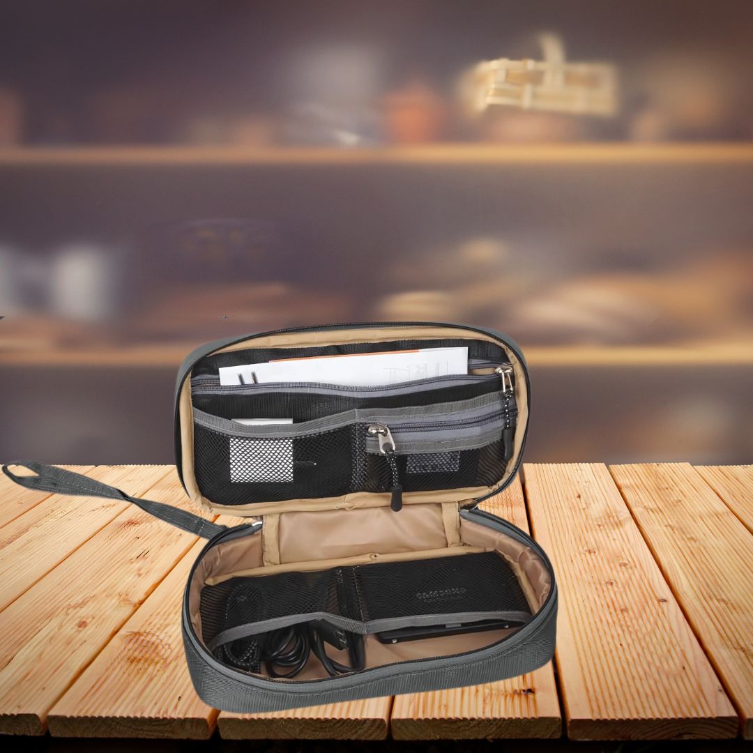 Tech gadget organizer open view with mesh pockets and accessories