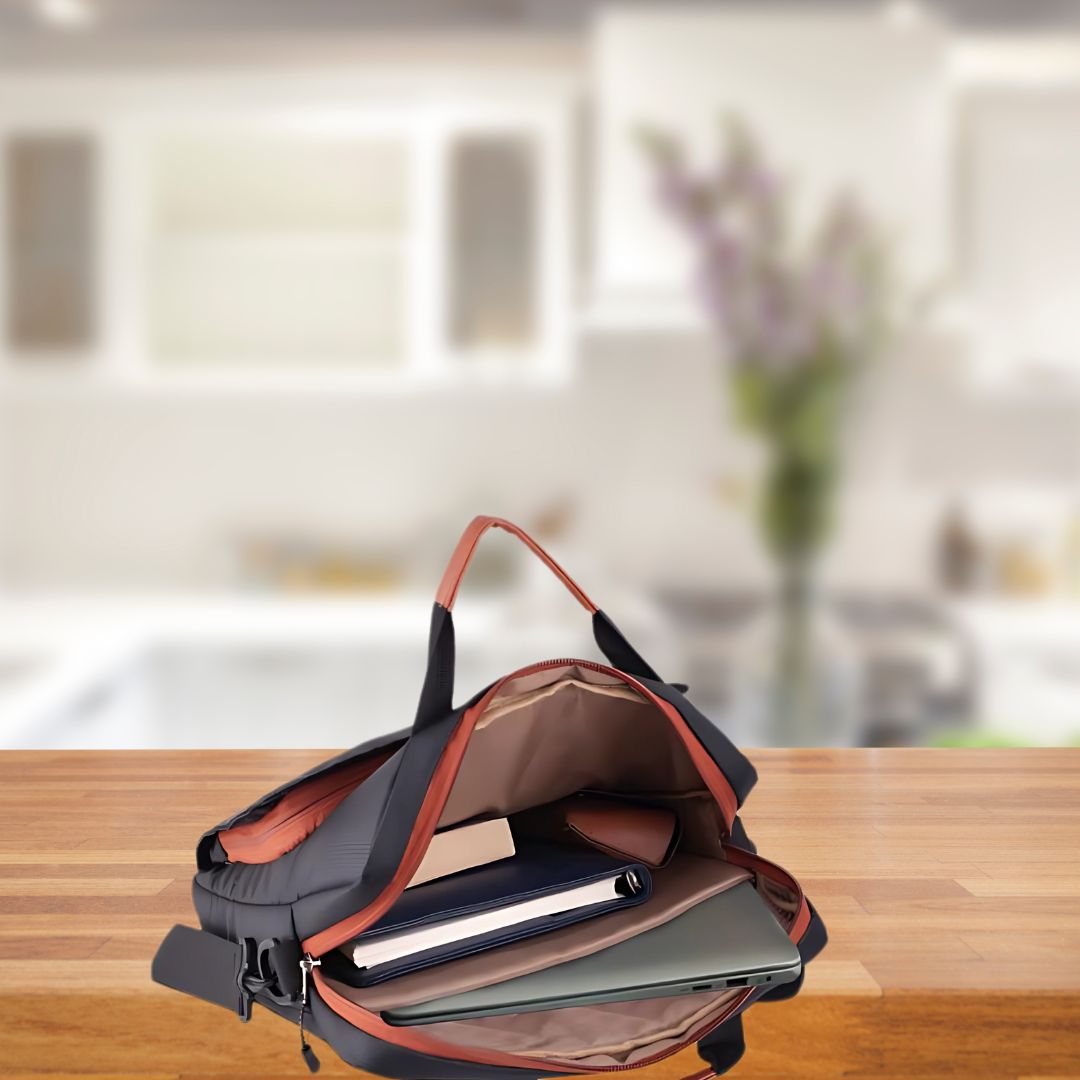 Sleek black sling laptop bag with brown highlights and adjustable strap