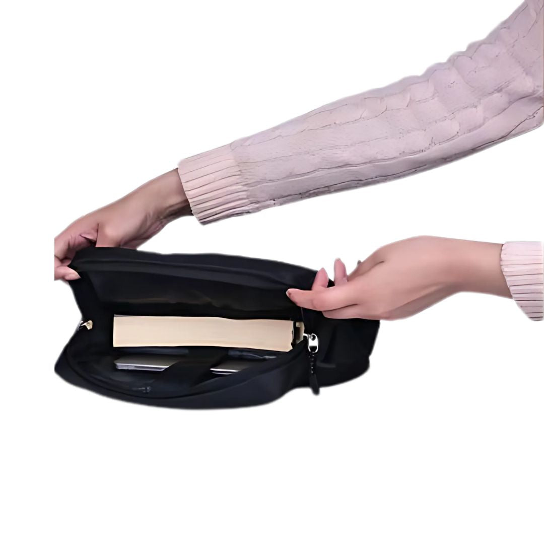 Black travel sling bag showing front pocket with document storage