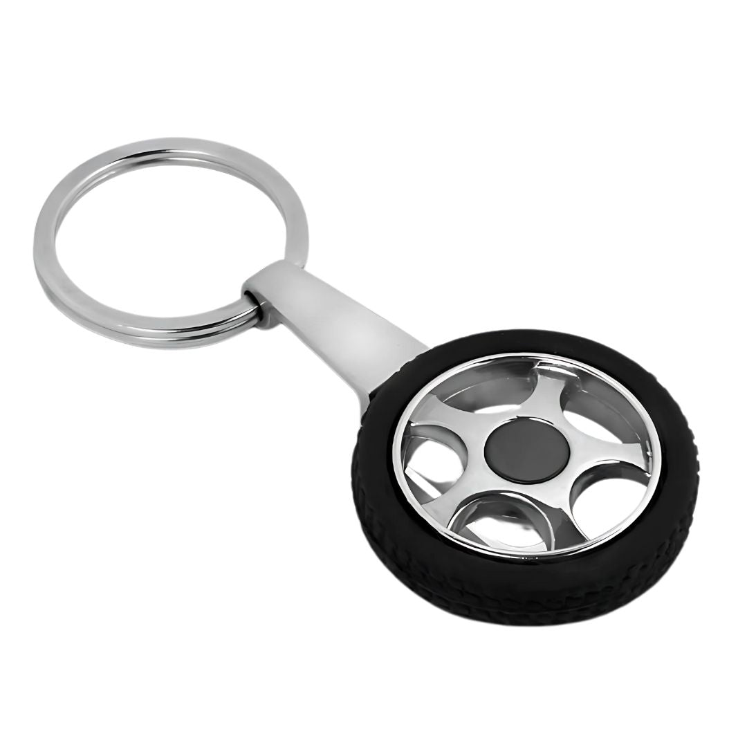 Tyre shape rotating keychain in hand with chrome finish