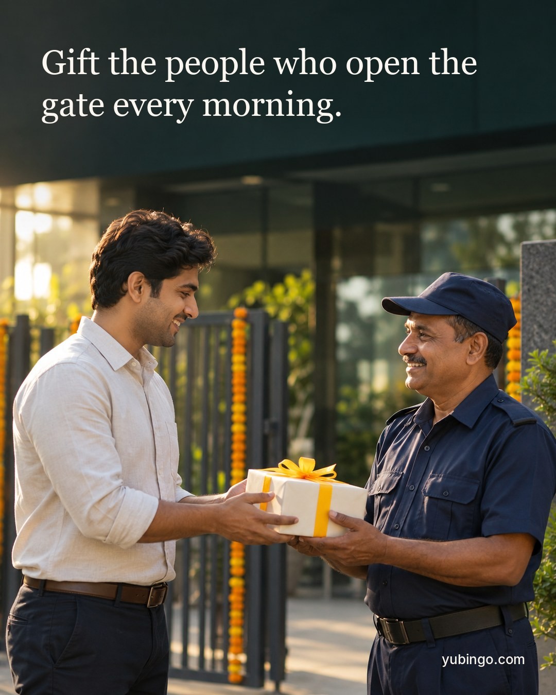 At an office gate in golden morning light, a young employee hands a gift box with a marigold ribbon to a smiling security guard. Text: Gift the people who open the gate every morning.